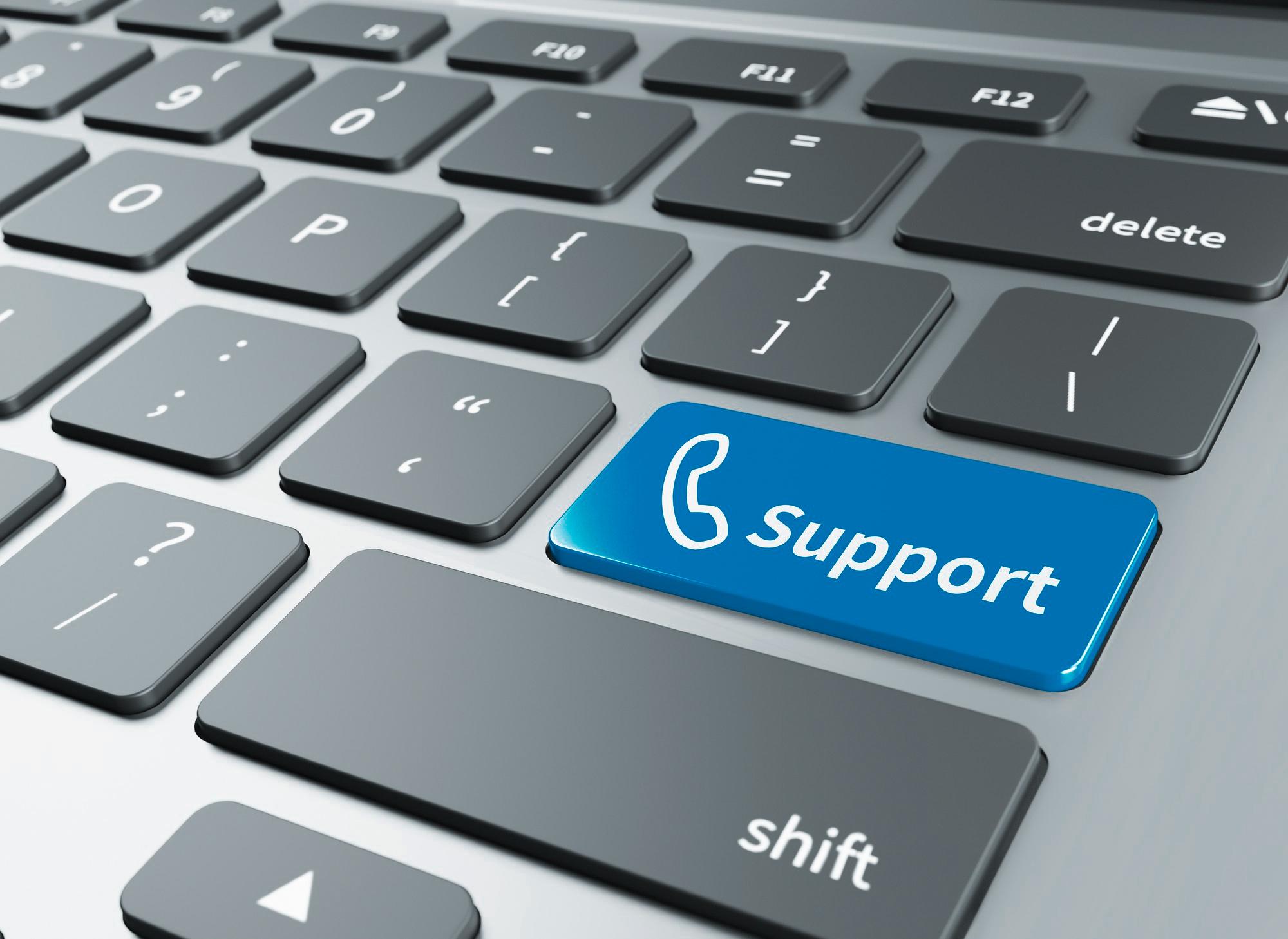 Computer keyboard with a blue key labeled Support
